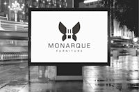 a black and white billboard with the monaque furniture logo