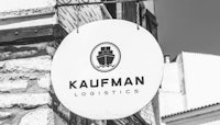 a black and white photo of a sign that says kalifman logistics